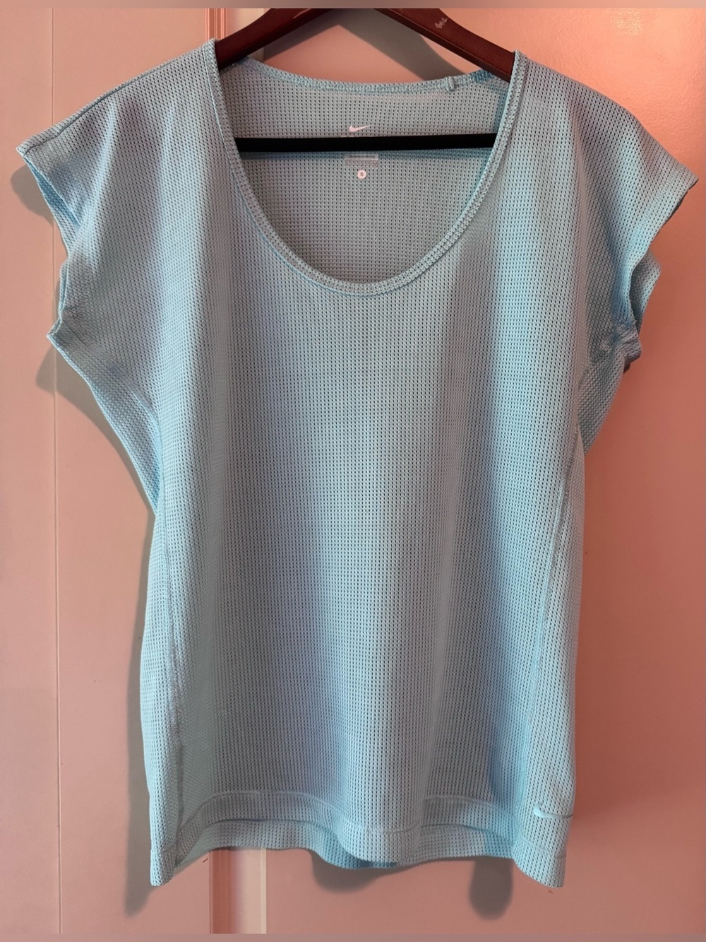 light blue Nike Dri-Fit women's short-sleeve athletic t-shirt.